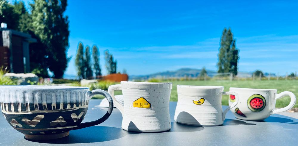 Handmade ceramic mugs with unique designs