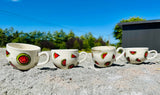 Handmade ceramic mugs with watermelon design on them